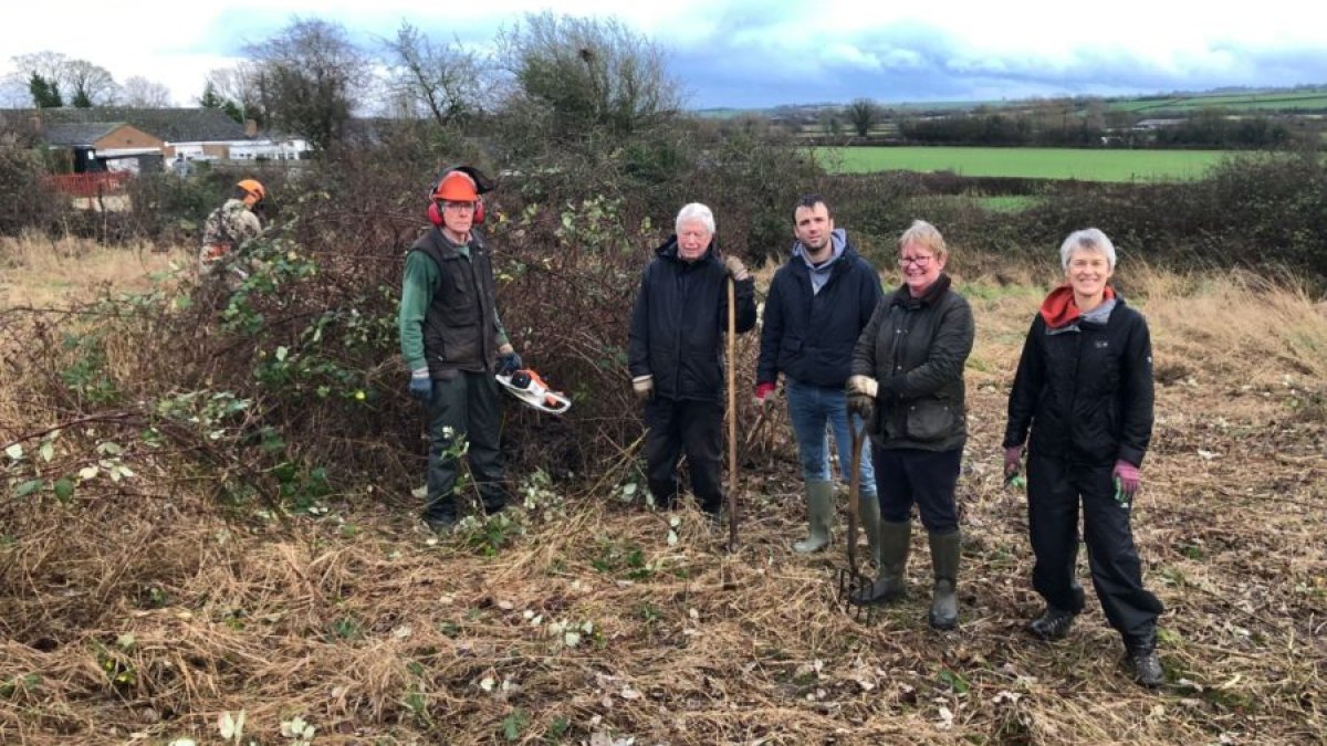 Volunteers working in Coronation Meadow