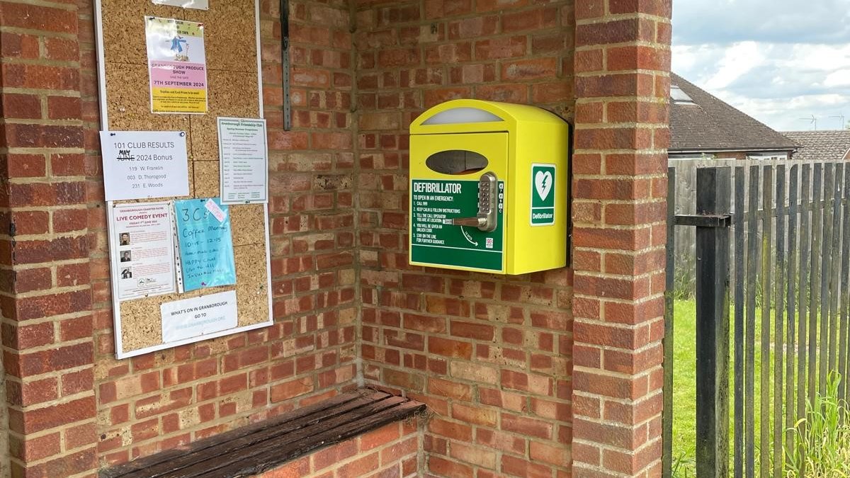 The defibrillator cabinet in the brick bus shelter outside Granborough Village Hall